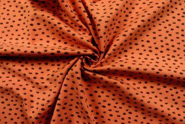 Jersey-Stoff mit wilden Tupfen - Terra/Schwarz 