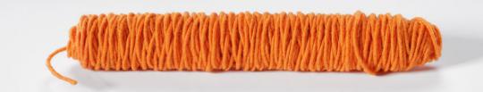 Wollkordel gefilzt 5 mm stark - Jutekern - 55 m-Rolle Orange